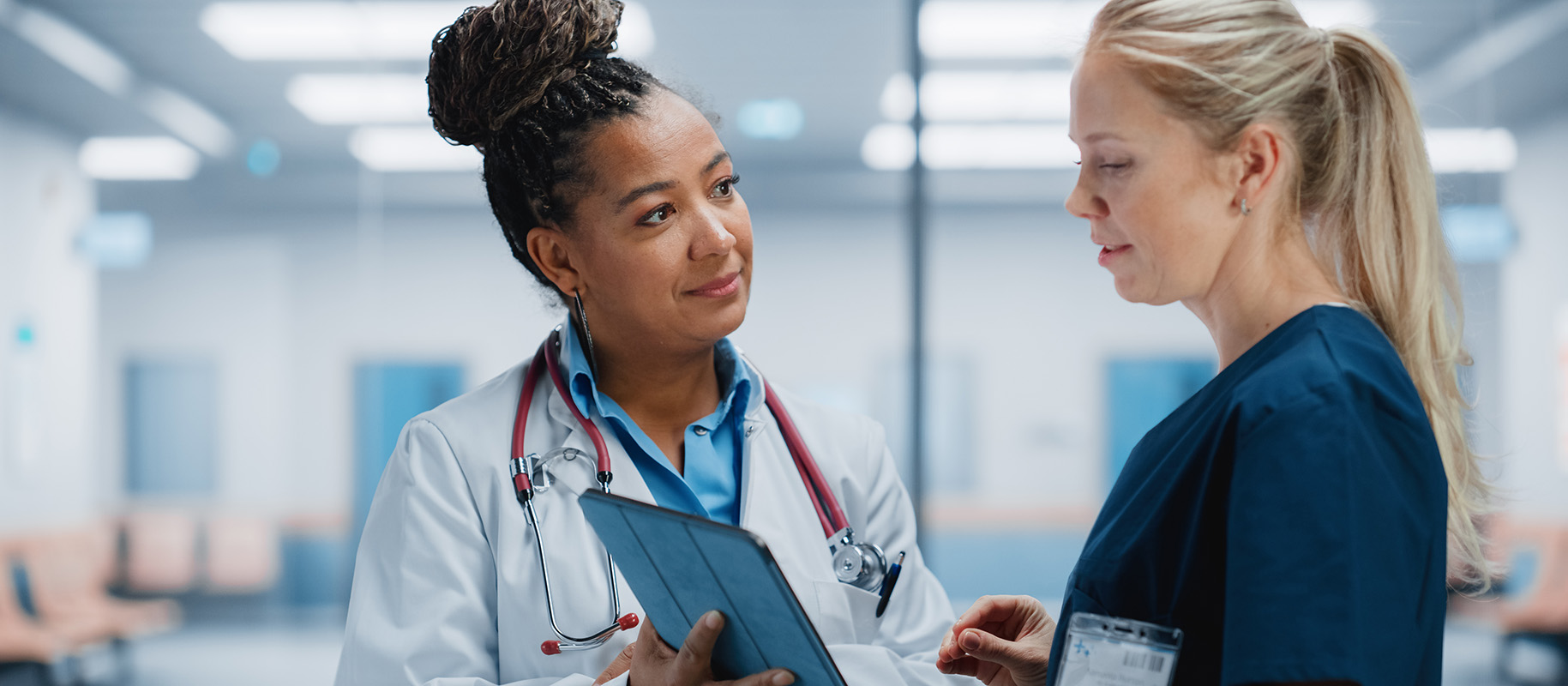 Nurse and doctor chatting -- courtesy Getty Images.