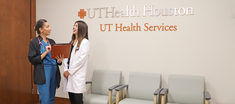 Dr. Mitzy Kobeissi with a student in the UT Health Services Lobby